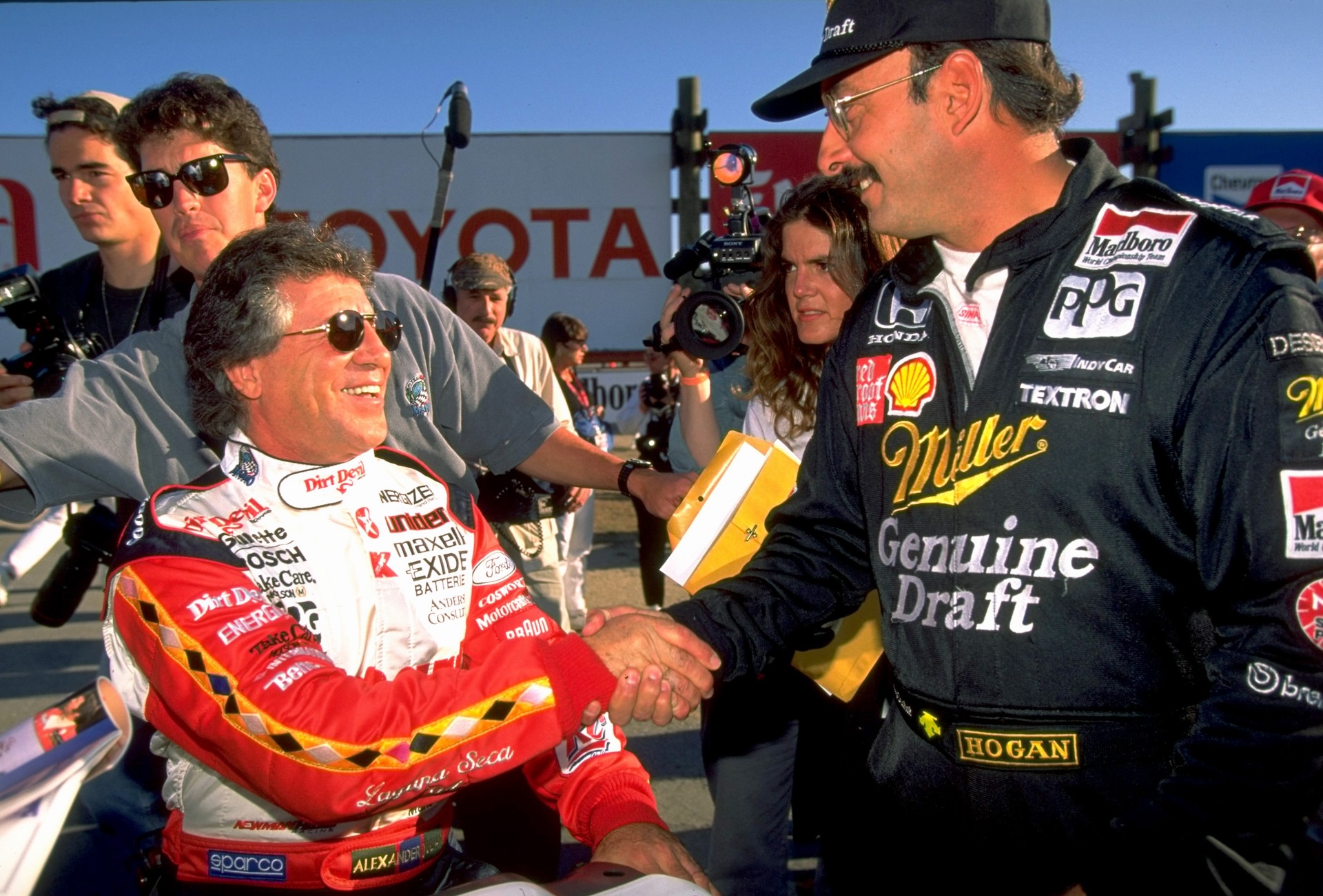 Auto Racing: Monterey Grand Prix: Mario Andretti (L) shaking hands with Bobby Rahal before Mario's last Indy race at Mazda Raceway Laguna Seca. Monterey, CA 10/9/1994 CREDIT: George Tiedemann (Photo by George Tiedemann /Sports Illustrated/Getty Images) (Set Number: X47062 )