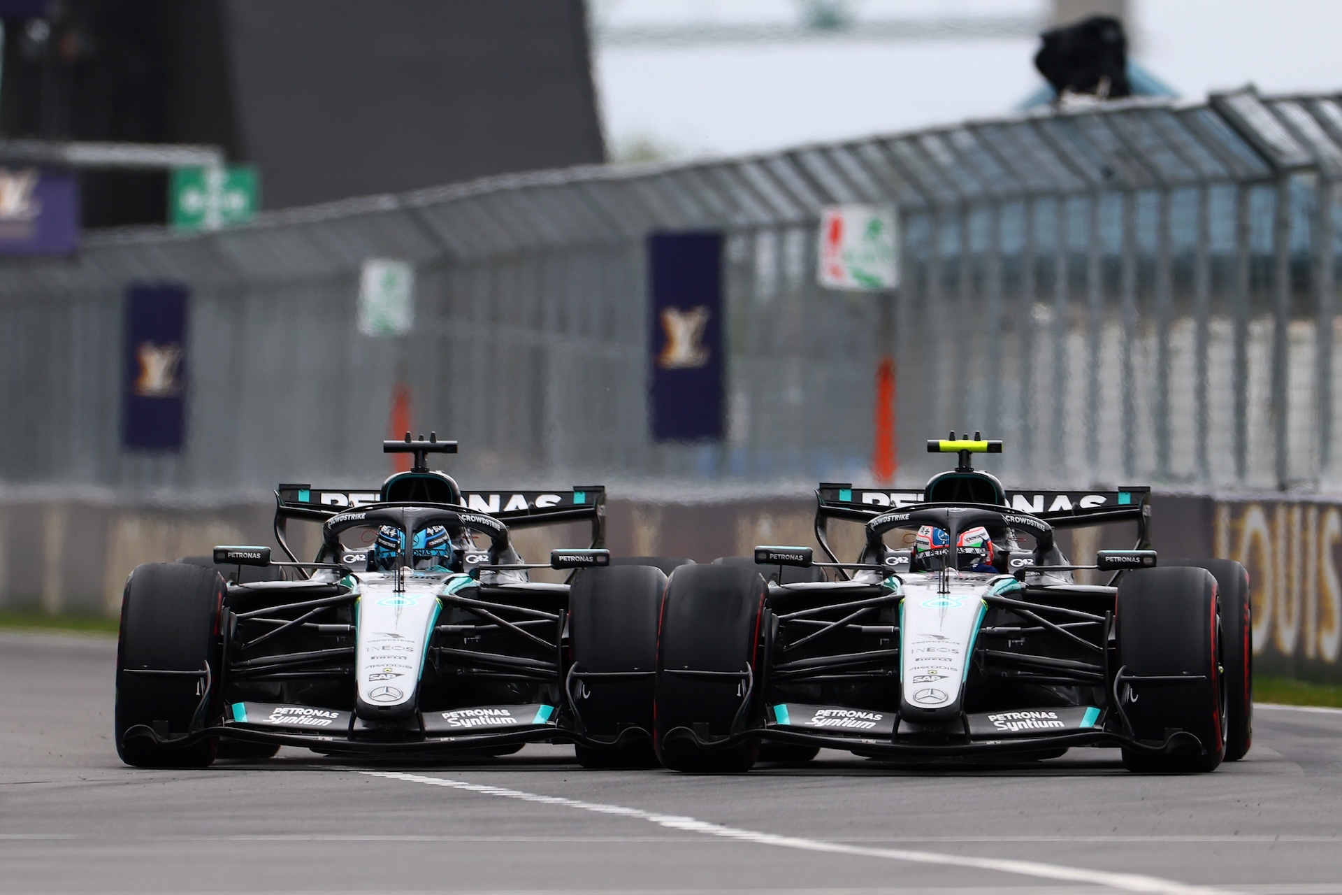 MONTREAL, QUEBEC - MAY 24: George Russell of Great Britain driving the (63) Mercedes AMG Petronas F1 Team W17 and Andrea Kimi Antonelli of Italy driving the (12) Mercedes AMG Petronas F1 Team W17 battle for track position during the F1 Grand Prix of Canada at Circuit Gilles-Villeneuve on May 24, 2026 in Montreal, Quebec. (Photo by Bryn Lennon - Formula 1/Formula 1 via Getty Images)