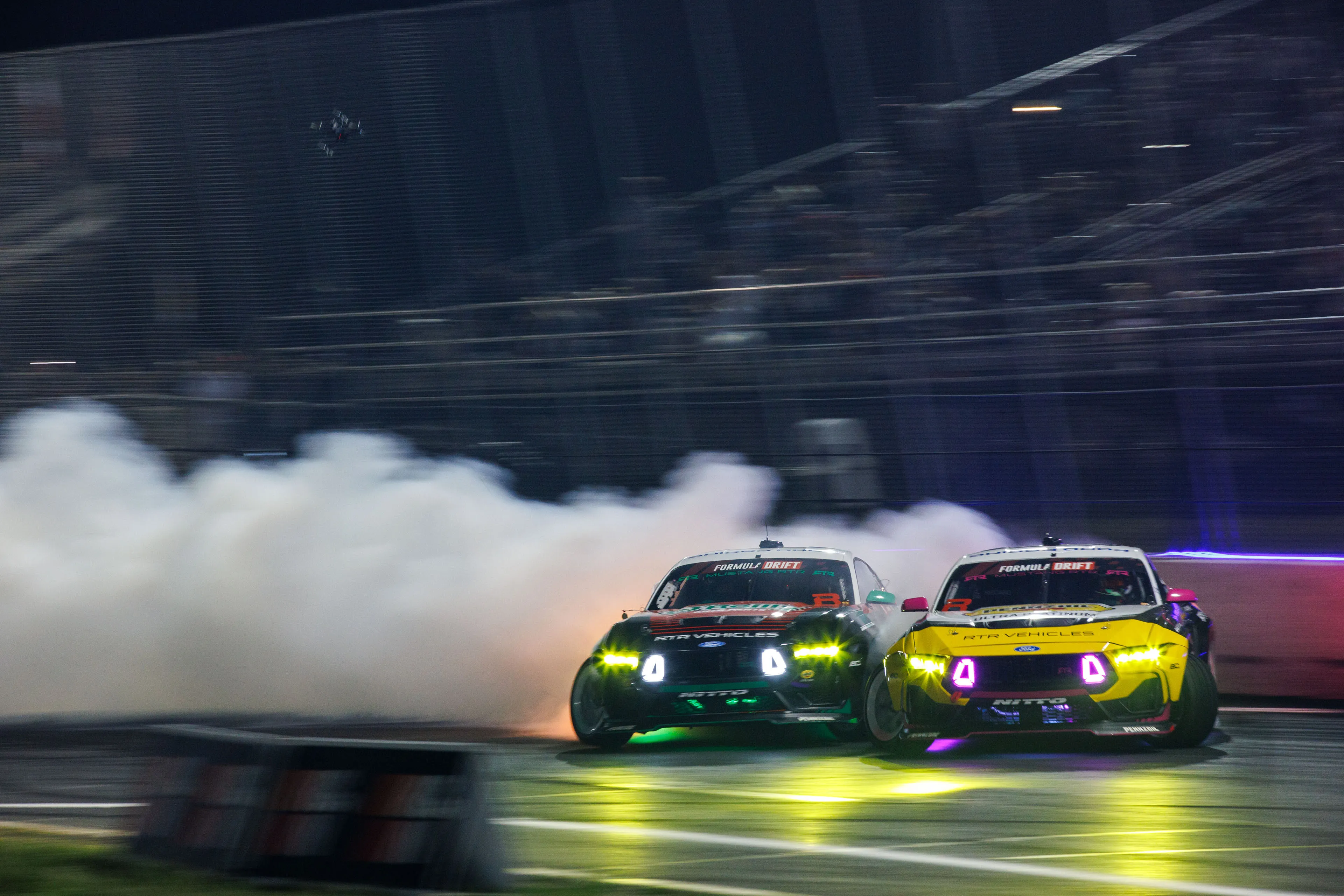 RTR Mustangs drifting.