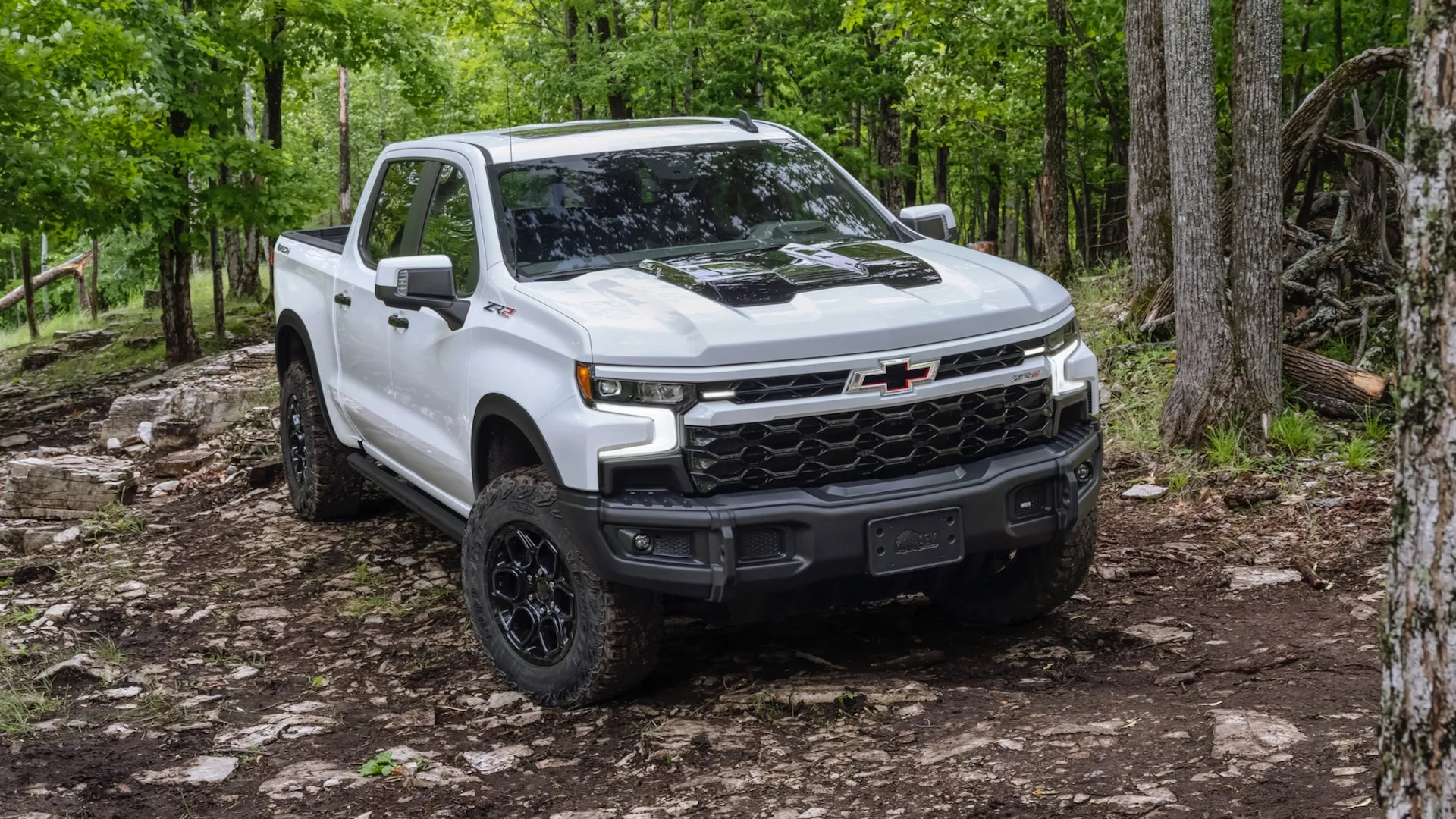 The 2024 Chevrolet Silverado ZR2 Bison on a wooded off-road trail