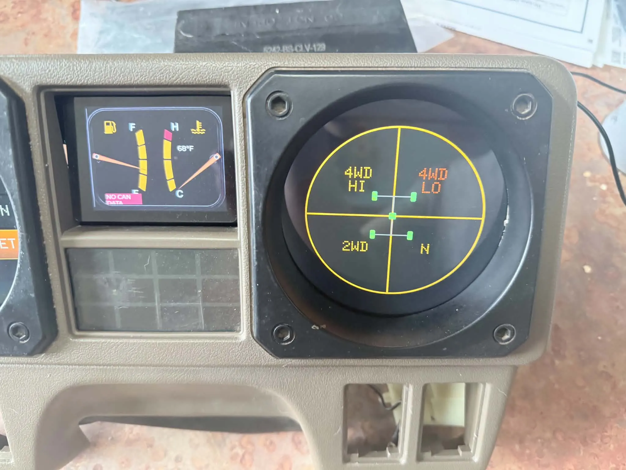 Custom digital gauges housed inside factory Mitsubishi Montero cluster