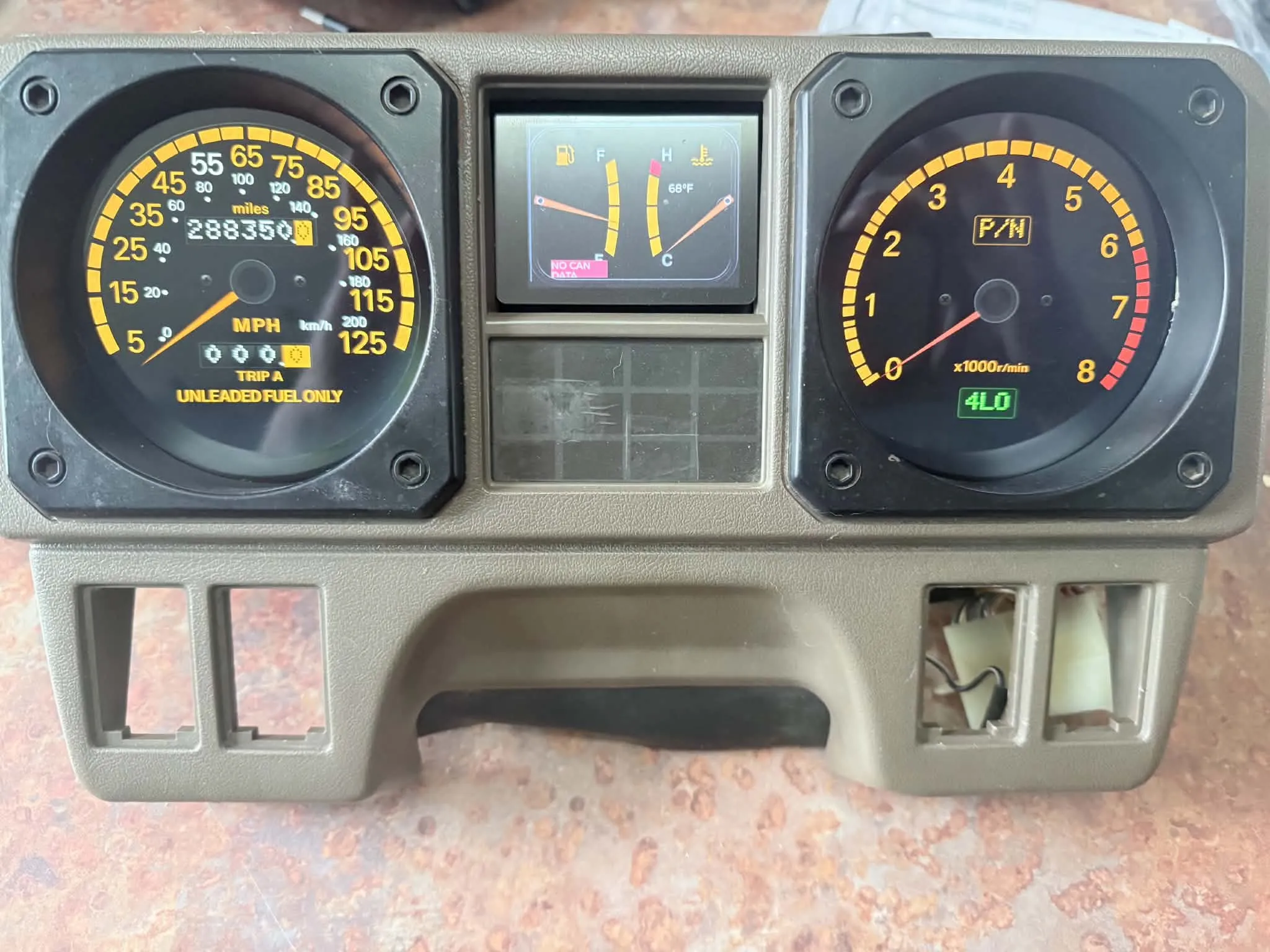 Custom digital gauges housed inside factory Mitsubishi Montero cluster