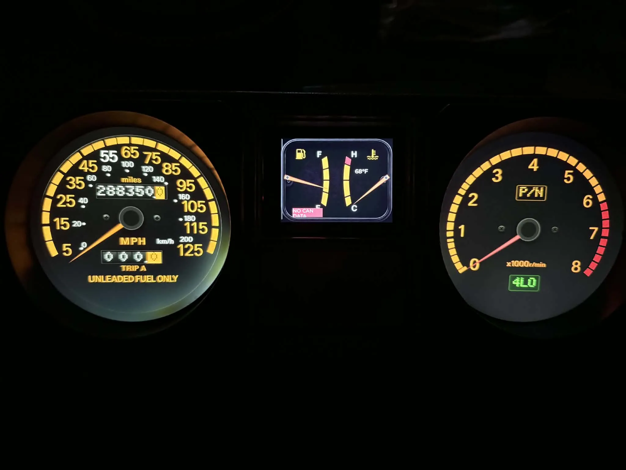 Custom digital gauges housed inside factory Mitsubishi Montero cluster