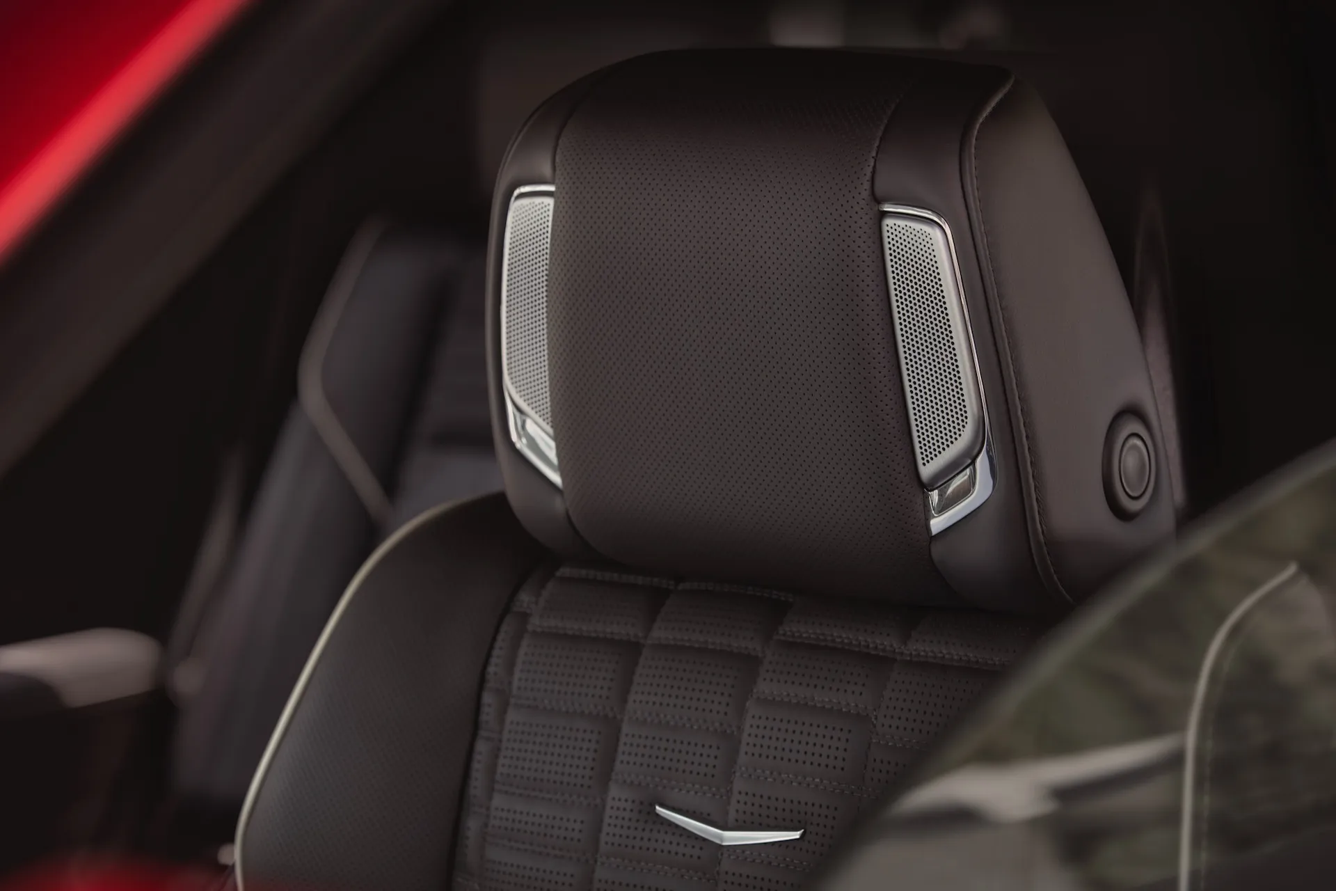Close-up shot of the top of seat and headrest with AKG speakers in the 2025 Cadillac Escalade-V.